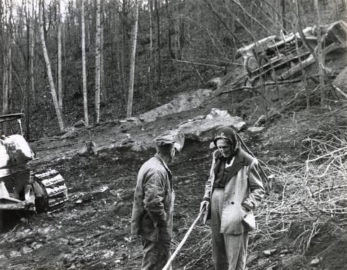 Ollie “Widow” Combs talking with bulldozer operator