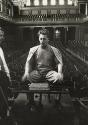 Herbert von Karajan, Austrian conductor, sitting on stage