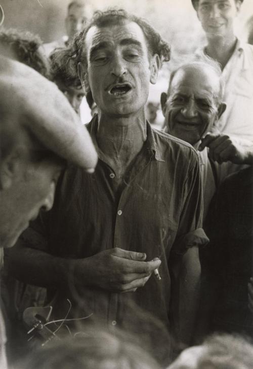 Man with cigarette in hand, at gypsy wedding, Saintes Maries de la Mer, France