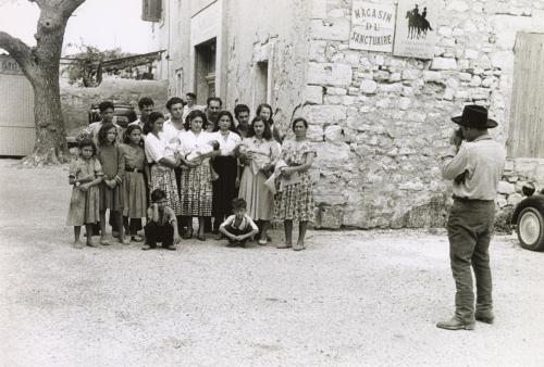 Group portrait of the gypsies next to Magasin du Sactuaire, Saintes Maries de la Mer, France