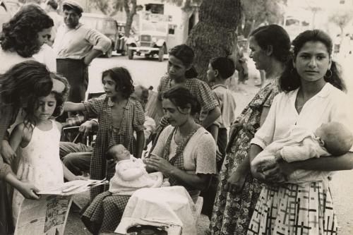 Gypsy women caring for their children, Saintes Maries de la Mer, France