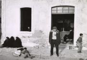 Villagers in front of a storefront, Portugal