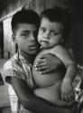 Boy holding baby, El Salvador