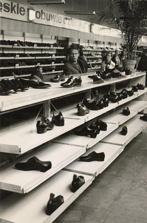 Man behind shoe display, Warsaw, Poland