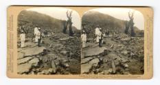 Scientists and Naval Officers exploring the ruins of St. Pierre–covered with volcanic ashes from Mount Pelee, Martinique, W. I.