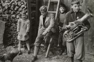 Portrait of children refugees with chicken and instrument