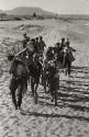 Suddenly Last Summer: Band marching through sand