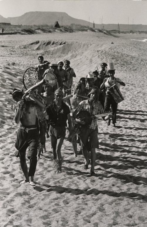 Suddenly Last Summer: Band marching through sand