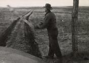 Farmer throwing blurred object, Freedom, Oklahoma