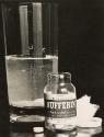 Bufferin advertisement – still life with pill bottle and a glass of water