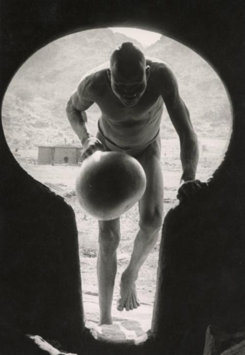 The Nubas. The keyhole entrance to a Nuba house in the Korongo Jebels (mountains). Doorways are shaped to allow admittance to people carrying loads of firewood on their heads, Kordofan, Sudan