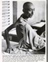 Meals are Good Medicine: man raises himself up on his bed in "Home for the Dying Destitute" in downtown Calcutta, India. Food is so rare in famine-struck India that some patients recover just through regular eating and leave the home, started 5 years ago when government gave Catholic nun an old Hindu pilgrim's hostel