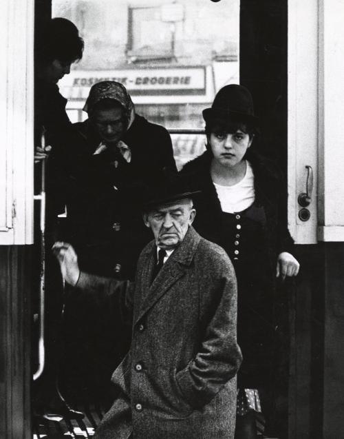 Man and two women exiting bus