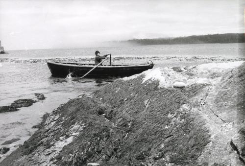 Man rowing boat, Chiloé Island, Chile