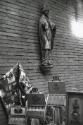 Tabaco display under religious sculpture, Germany