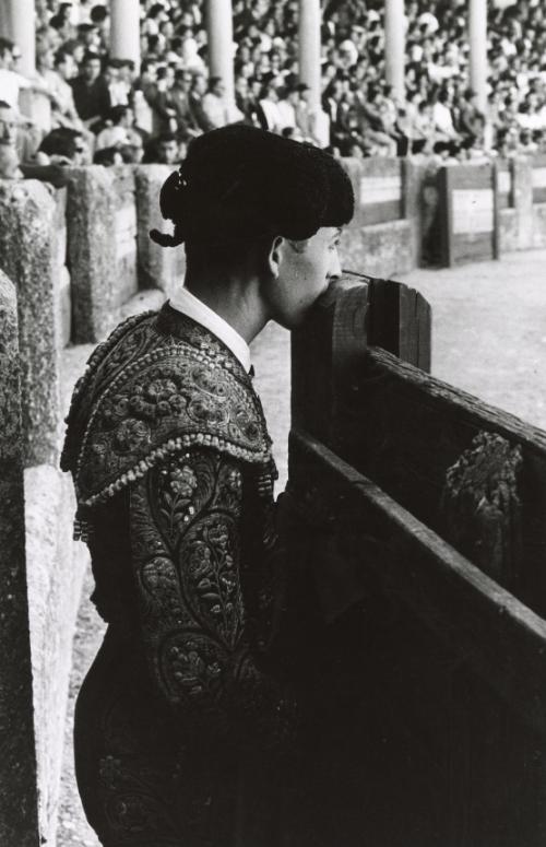 The peons will deliver the bull to the matador…(matador leaning face into wood fence), Spain, from the series La Corrida (The Bullfight)