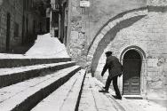 A man makes his way through Petralia Soprana for the local Saints' Day Festival, Sicily