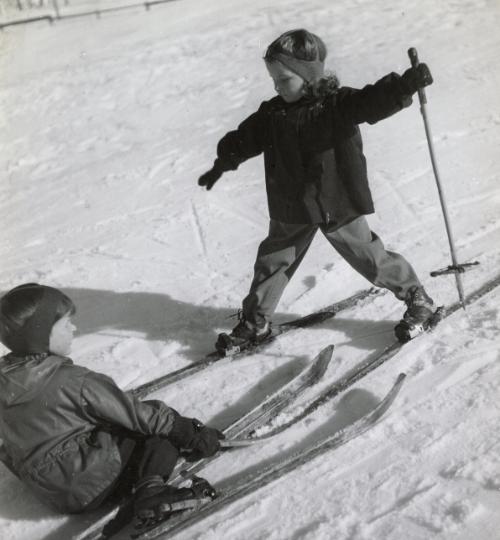 Girl balancing on skis