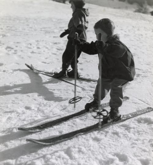 Girl pushing herself forward on skis
