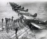 Pilots of No. 87 Squadron practicing a scramble to their Hawker Hurricane Mark Is at Lille-Seclin