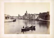 Men on boat in canal, Venice