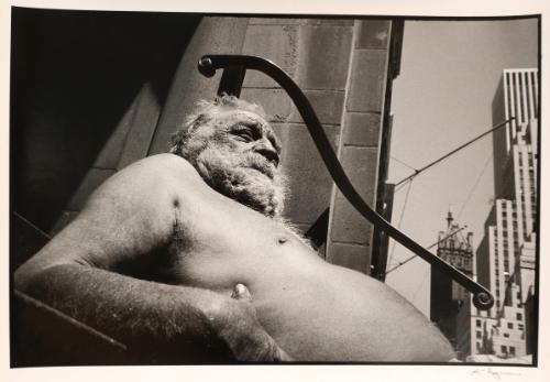 Shirtless old man sunbathing in the city, New York, from the "Hipshot" series.