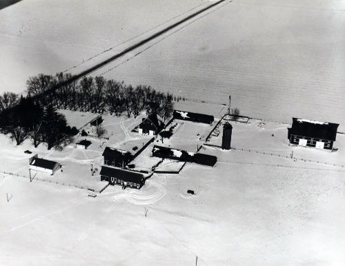 Aerial view of farm in winter, Grundy County, Iowa