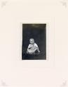 Untitled [smiling baby seated on table]