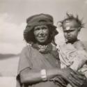 Mother carrying a child from a village in the Dadès Valley, Morocco