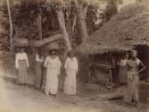 Women carrying woven baskets on their heads, Ceylon