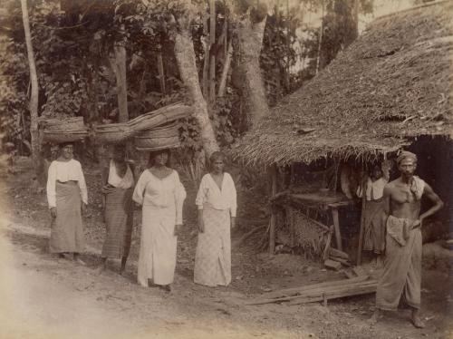 Women carrying woven baskets on their heads, Ceylon