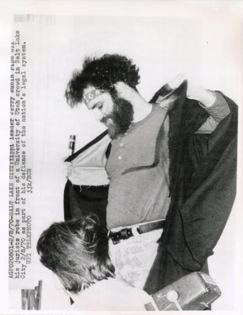 Yippie leader Jerry Rubin rips off his jurists robe in front of a University of Utah crowd in Salt Lake City, Utah as part of his defiance of the nation's legal system.