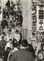 Crowd descends stairs in city center, Japan, 1960