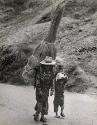 Mother with son carrying goods to the market of Chichicastenango, Guatemala, 1961