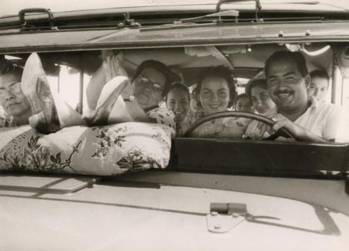 Portrait of large family in car, South America, ca. 1960s