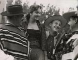 Gauchos with young lady during the annual festival of the Chilean "Guasos" (Gauchos), "Medialuna", in Rocangua, Chile, 1965