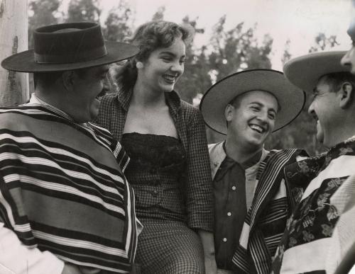 Gauchos with young lady during the annual festival of the Chilean "Guasos" (Gauchos), "Medialuna", in Rocangua, Chile, 1965