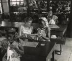 Sewing lessons are still very frequent. Many women born in small villages in the bush never held a needle in their fingers before registering for the "Foyers Social" classes given by the Red Cross, Leopoldville, the Belgian Congo (now Kinshasa, Democratic Republic of the Congo), 1959