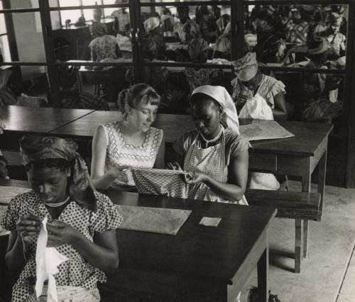 Sewing lessons are still very frequent. Many women born in small villages in the bush never held a needle in their fingers before registering for the "Foyers Social" classes given by the Red Cross, Leopoldville, the Belgian Congo (now Kinshasa, Democratic Republic of the Congo), 1959